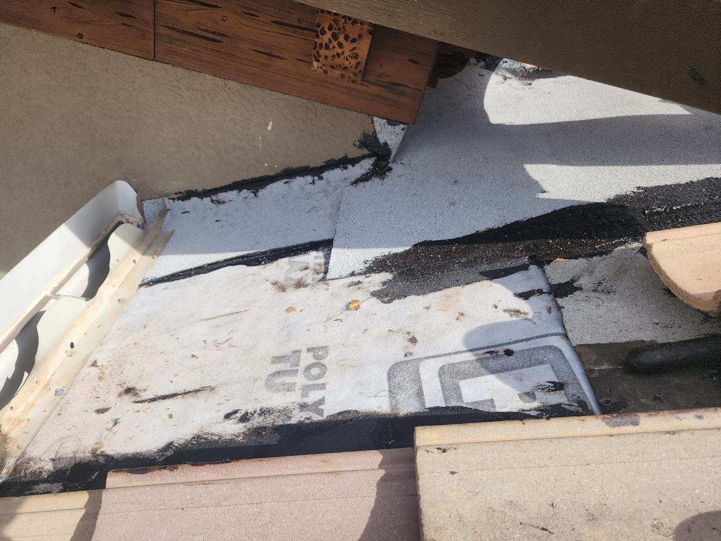 Repaired roof flashing and sealed roof valley where a roof leak entry point was fixed